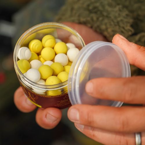 OMC Paella Boosted Fluoro Pop Ups 14 mm White • Yellow - open 200 ml tub showing white and yellow fluoro pop up boilies