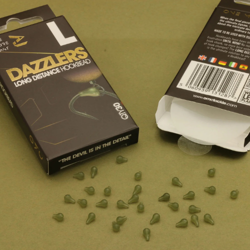 Āķu gumijas OMC Dazzlers Long Distance Hookbead (30gb)