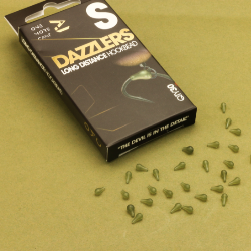 Āķu gumijas OMC Dazzlers Long Distance Hookbead (30gb)