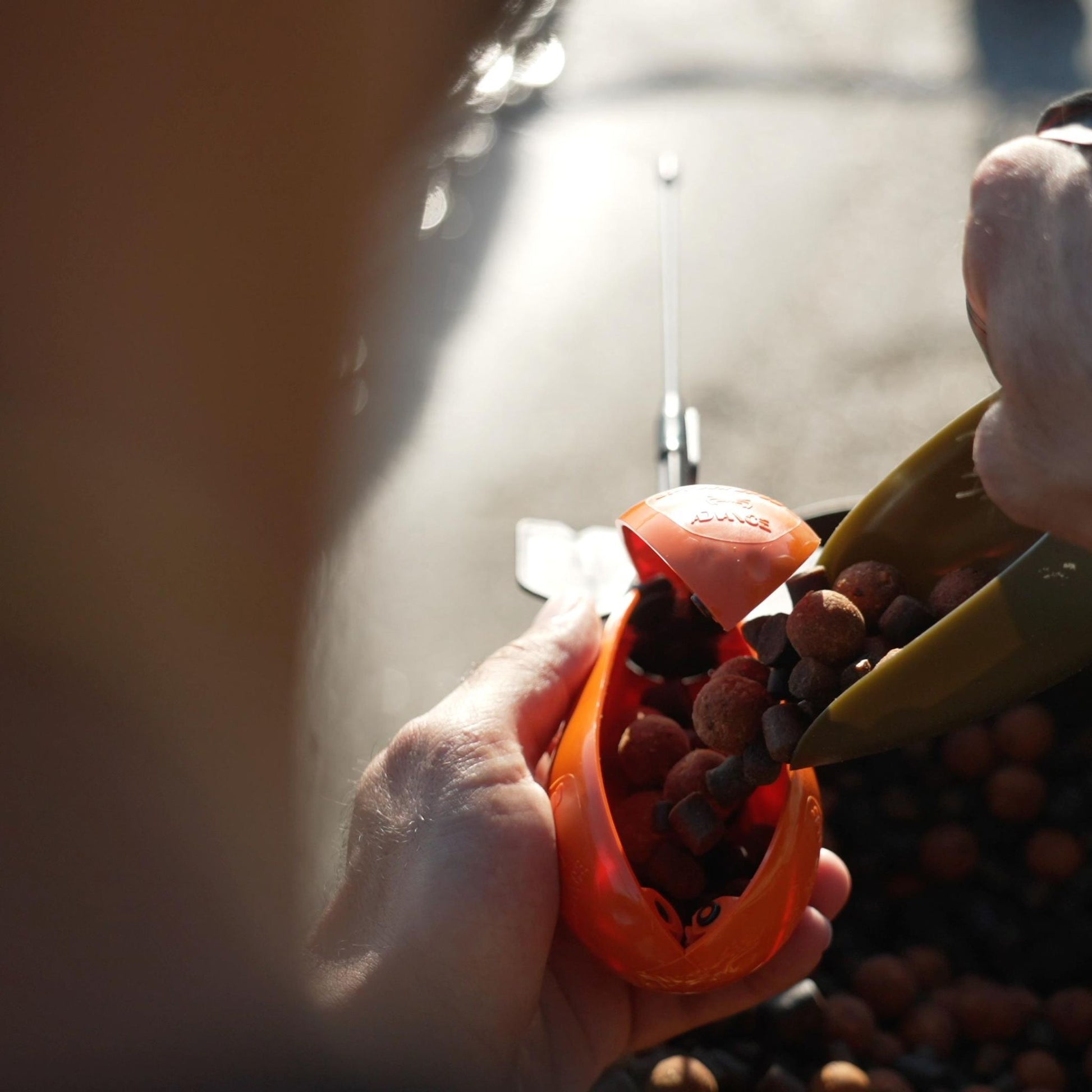 Loading Advance Spyder Spod with bait for spodding