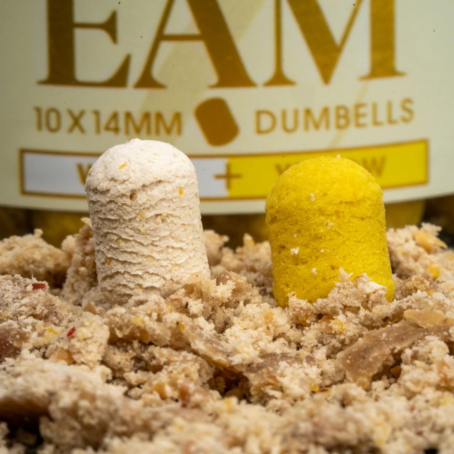 OMC iScream Boosted Fluoro Wafters White Yellow 14 mm on crushed boilies with 200 ml tub in background