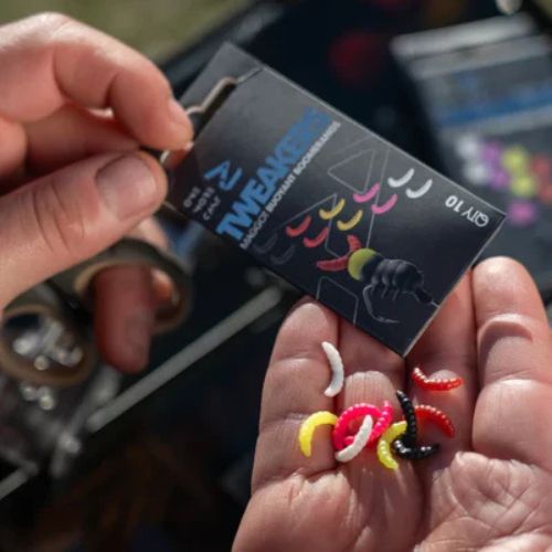 Tweakers Maggot Boomerangs - pack close-up with 10 imitation maggots in five colours poured onto palm